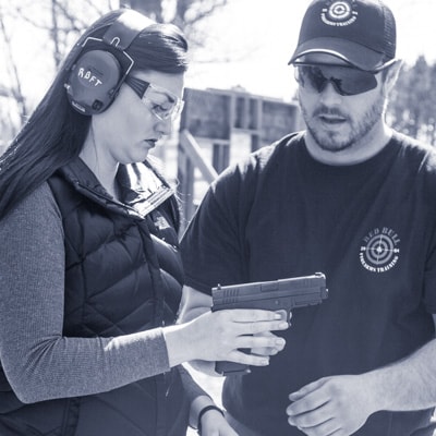 Instructor with student at Introduction to Firearms Classes